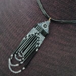 Vintage choker length cord necklace with art deco style beaded pendant black